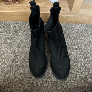 Black nylon heeled boots with rubber sole